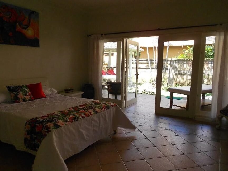 A bedroom opening onto the garden